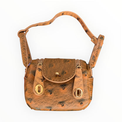 Brown ostrich design poopy bag holder for outings and walks with your dog. 
