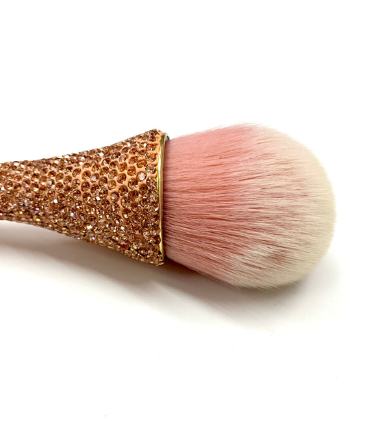 Make up brush. Gold