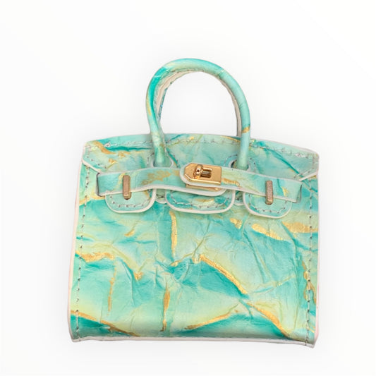 Green gold poopy bag holder for outings and walks with your dog. faux birkin barkin
