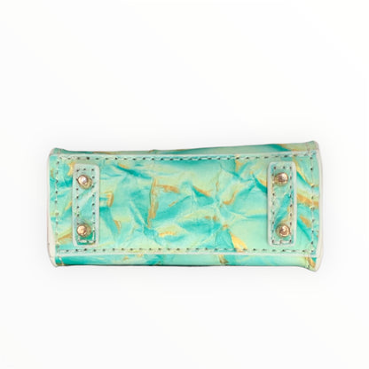 Green gold poopy bag holder for outings and walks with your dog. 