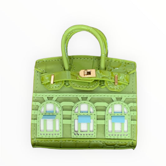 Green poopy bag holder for outings and walks with your dog. 