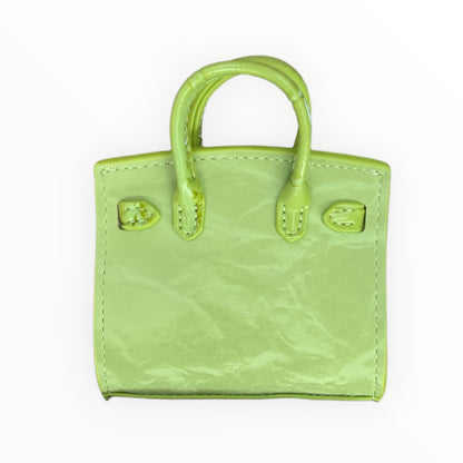 Green poopy bag holder for outings and walks with your dog. 