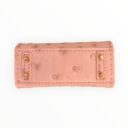 Pink poopy bag holder for outings and walks with your dog.