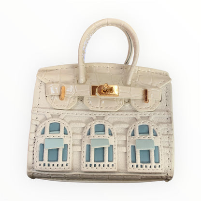 White poopy bag holder for outings and walks with your dog. 