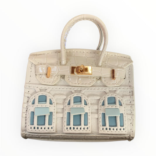 White poopy bag holder for outings and walks with your dog. 