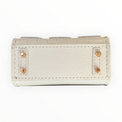 White poopy bag holder for outings and walks with your dog. 