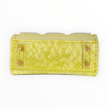 Yellow poopy bag holder for outings and walks with your dog.  faux barkin birkin bottom