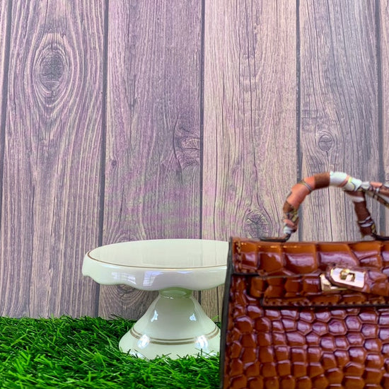 video of Brown poopy bag holder for outings and walks with your dog. 