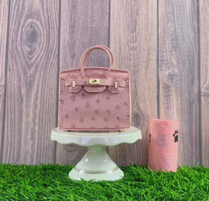 Pink poopy bag holder for outings and walks with your dog.